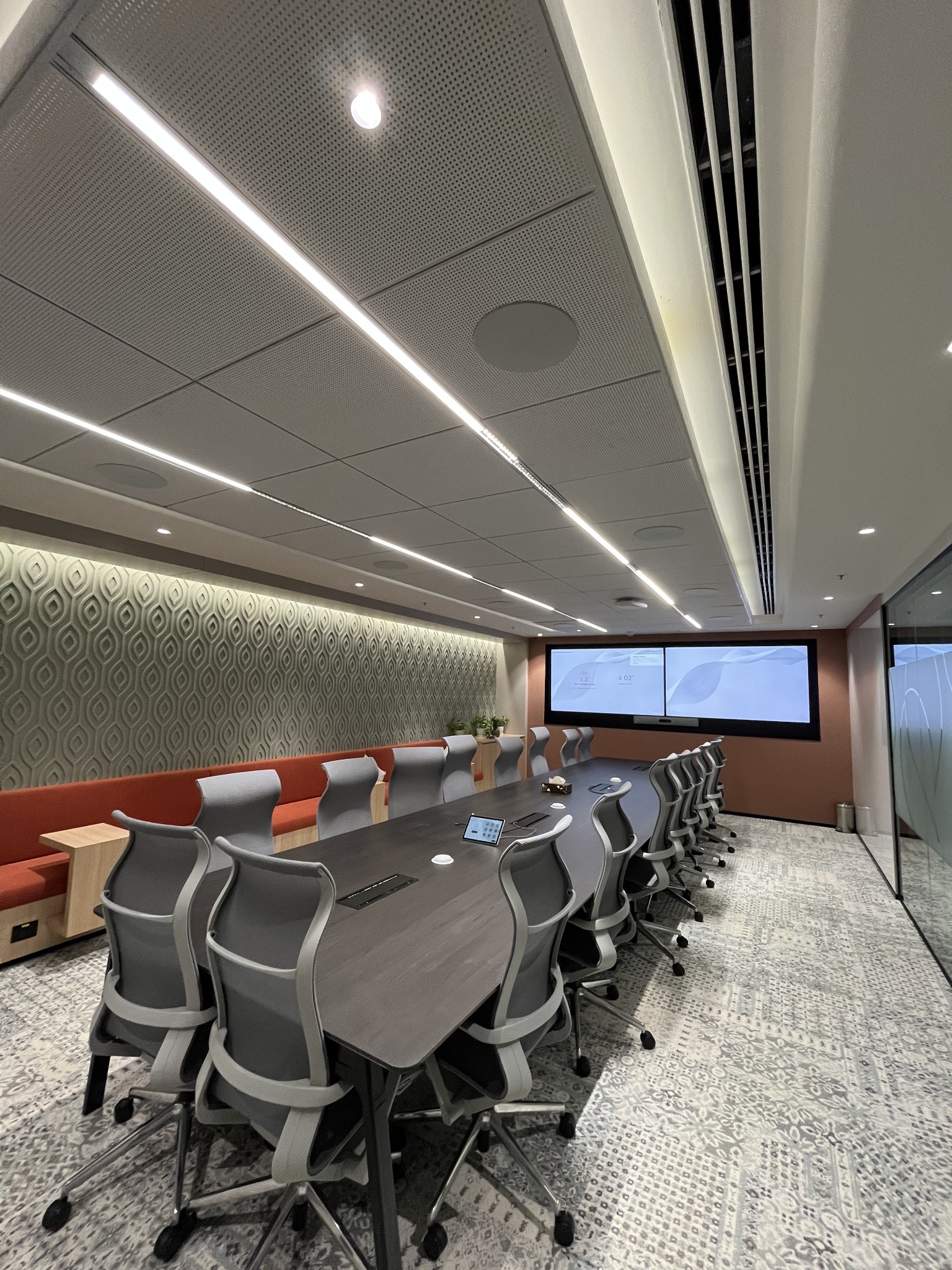 Omnyx deployed boardroom with dual displays and integrated conferencing